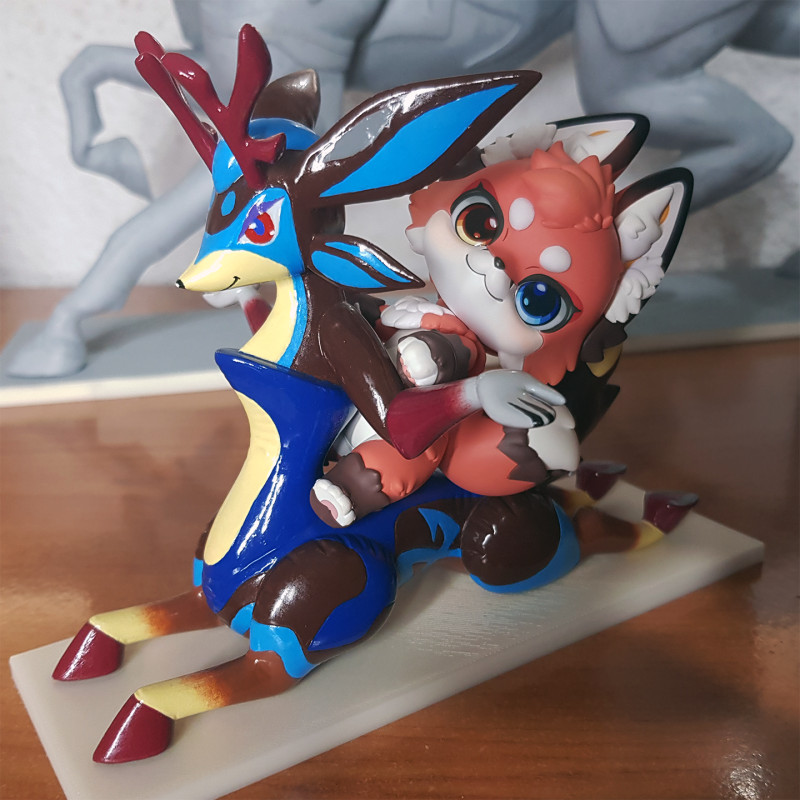 A Nendoroid (River) riding a figure of an inflatable deer taur (Deerise)